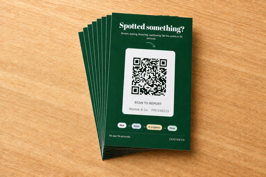 Freshly printed CentreOS report cards laid out on a table, each showing a different shop's name and PIN.